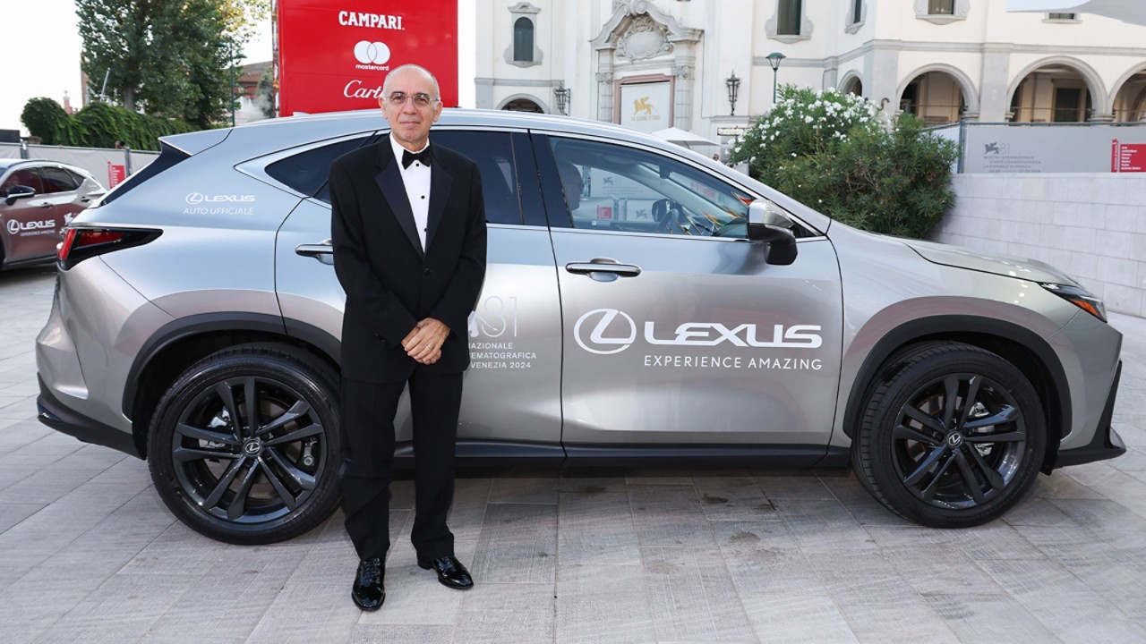 Giuseppe Tornatore stood in front of a Lexus at the Venice Film Festival.