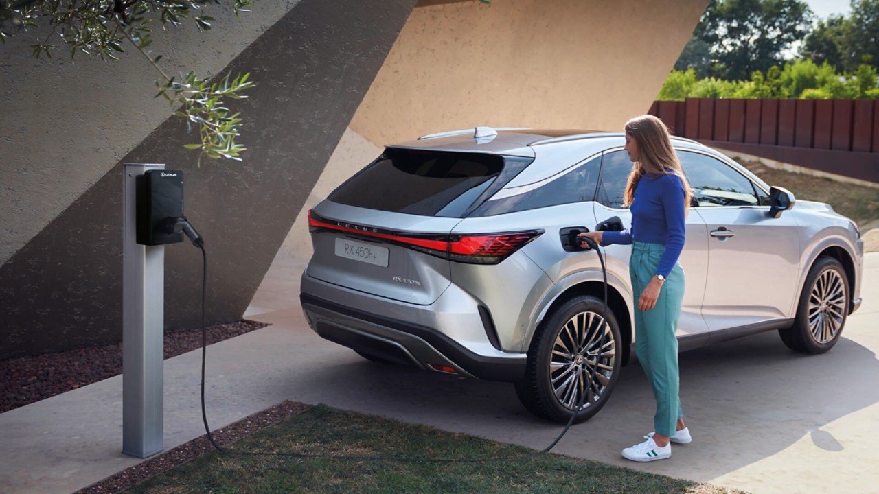 A person charging their Lexus using a Lexus HomeCharge